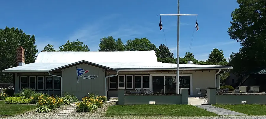 The clubhouse and flagpole in summer