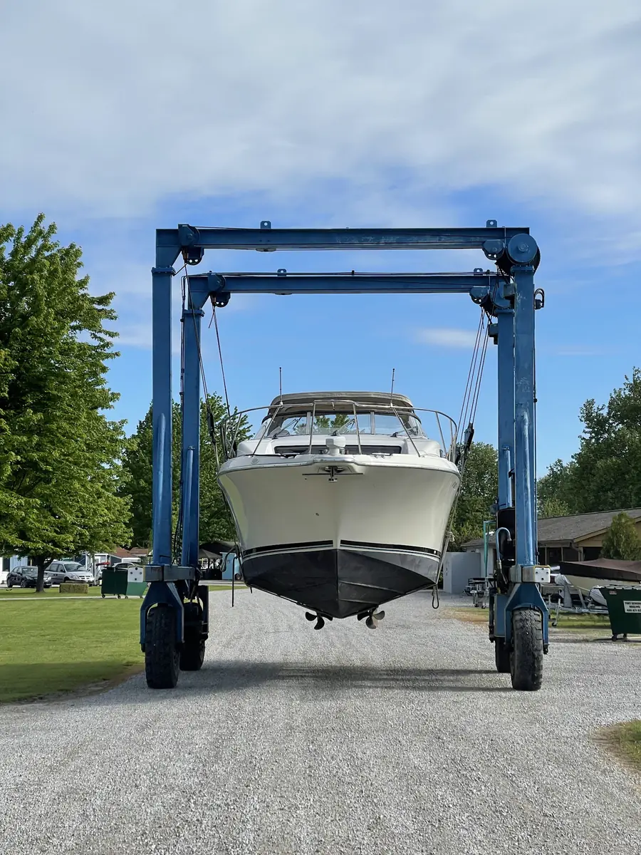 The club's travel lift carrying a powerboat